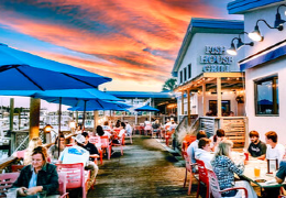 Diners eating on the patio at Fish House Grill restaurant in Wrightsville Beach. 